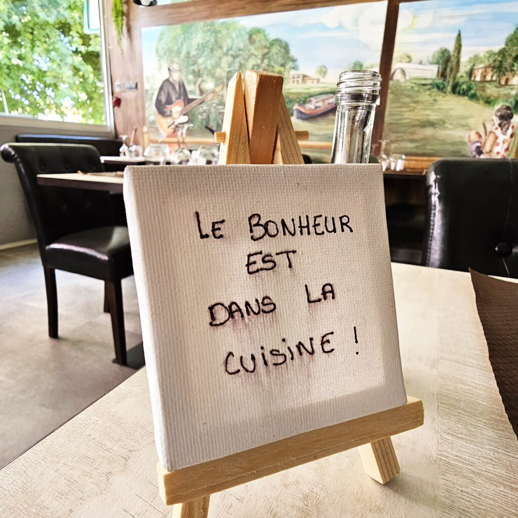 Happiness is in the kitchen - at O'Berges du Canal restaurant - photo by Arthur Breur