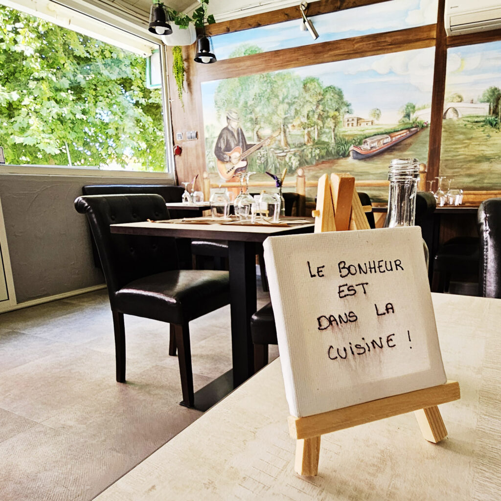 Happiness is in the kitchen - at O'Berges du Canal restaurant - photo by Arthur Breur